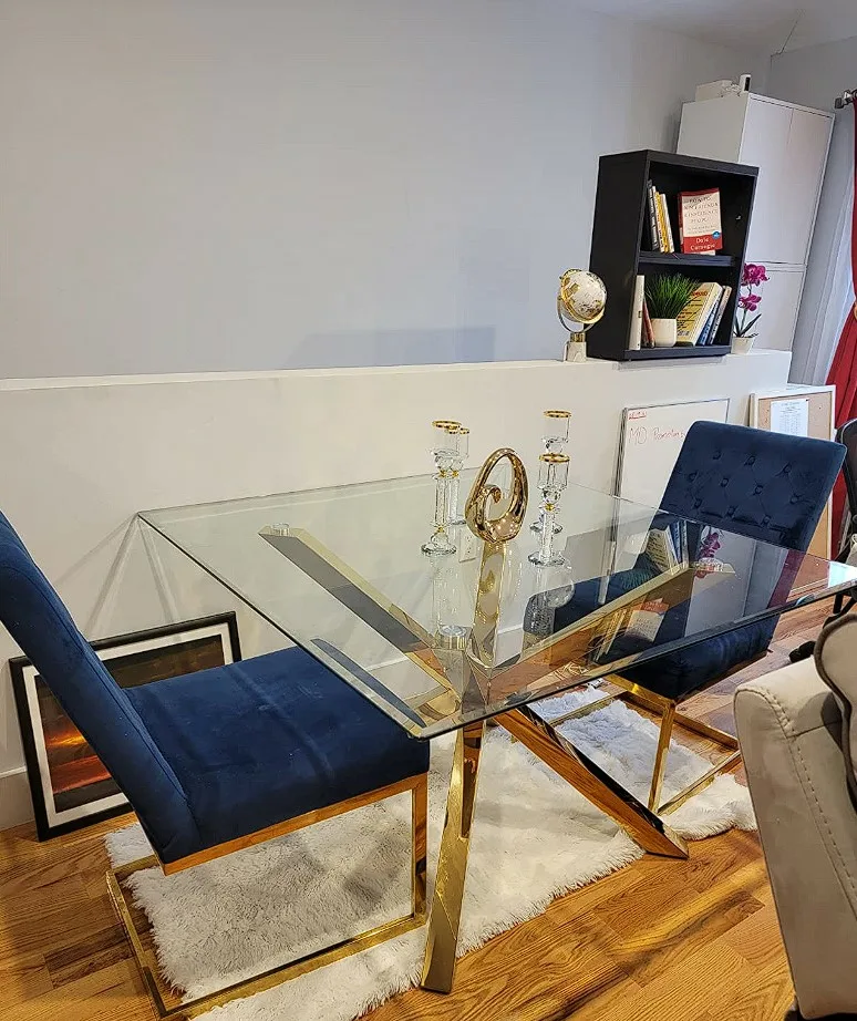 Glass Dinner Table Square Glass Top With Geometric Gold Base And Blue Cusioned Chairs