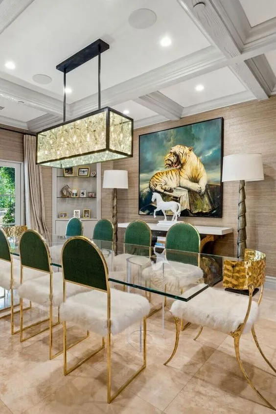 Glass Dinner Table With Clear Fiber Glass Base And Cusioned Gold Chairs