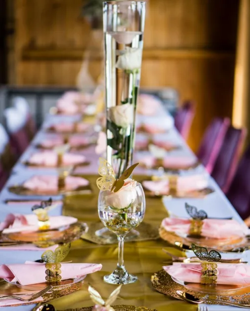 Gold Tablerunner Paper Butterfly Napkin Ring Closeup Blurry Wedding Dinner Tables