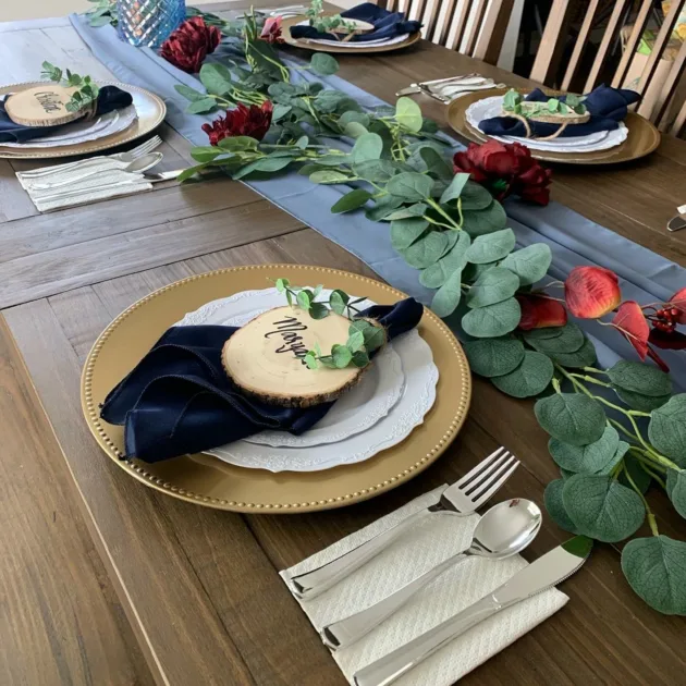 Green Eaucalyptus Leaf Garland Gold Beaded Charger Plates Dusty Blue Tablerunner Side Angle View Greenery Centerpiece Ideas