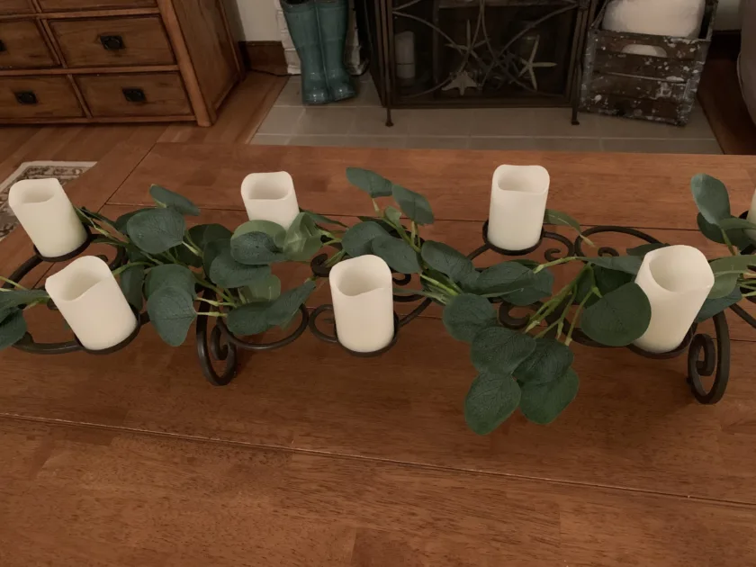 Green Eucalyptus Leaves Garland White Tealight Ledcandles Wooden Table Top Angle View Greenery Centerpiece Ideas