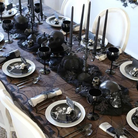 Halloween Dinner Tables Balck Candles And Black Skulls And Black Cloth Runner