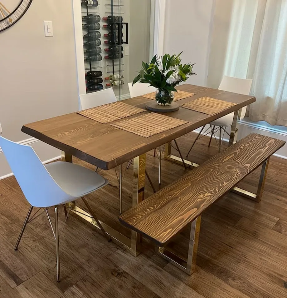 Rectangular Wooden Dining Table With Triangle Gold Base And Matching Bench Seat And White Chairs