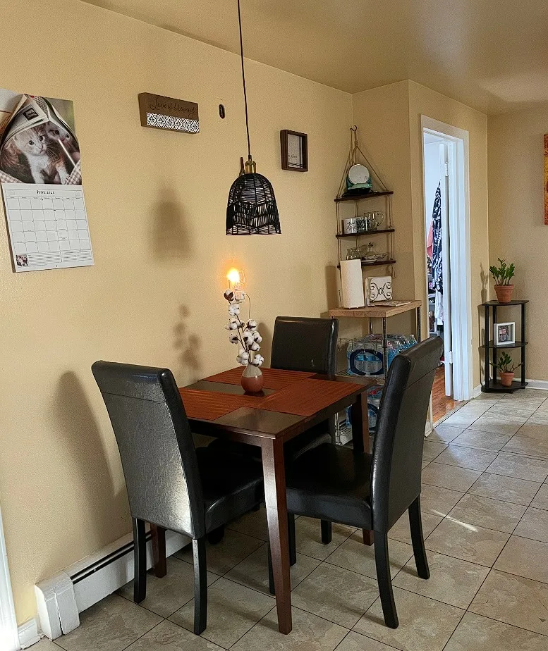 Square Dinner Table For 3 Seates Varnished Brown Color And Black Cusioned Chairs