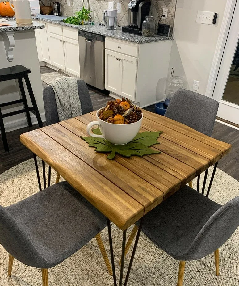 Square Dinner Table Wood Slabs Top With Metal Pin Legs And Gray Cusioned Chairs