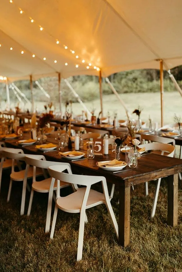 Wooden Dinner Tables Wedding Setup With White Painted Chairs