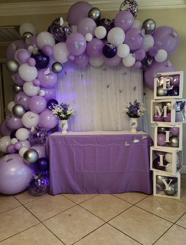 Purple Dining Tables With Balloon Backdrop Decorations