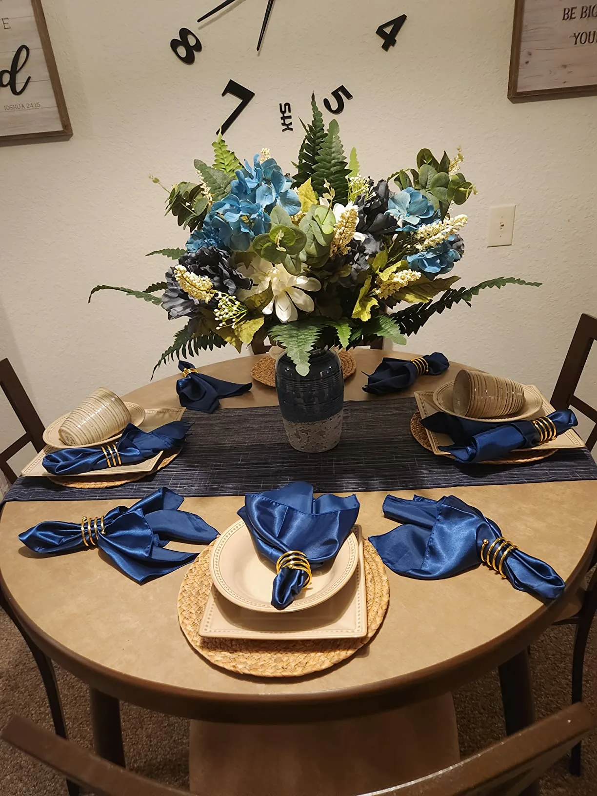 Blue Napkins Brown Rattan Table Placemats Flowers Centerpiece Angle View Dinner Table Setting