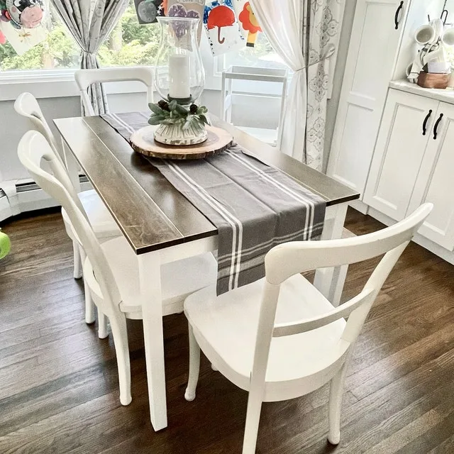 Modern Farmhouse Dining Rooms With Candle Holder Centerpiece On Wood Slice And Table Runner