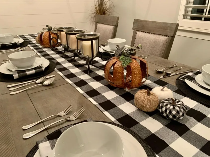 Tablescape Ideas For Fall Checkered Table Runner And Metal Pumpkin Centerpiece