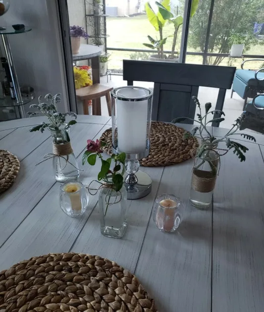 Italian Tablescape Ideas White Wood Top With Rattan Placemats And Bottle Vases